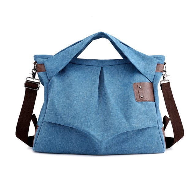 Modrá asymetrická kabelka přes tělo Buddha Trends